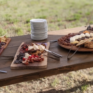 Charcuterie boards on table at wedding reception.